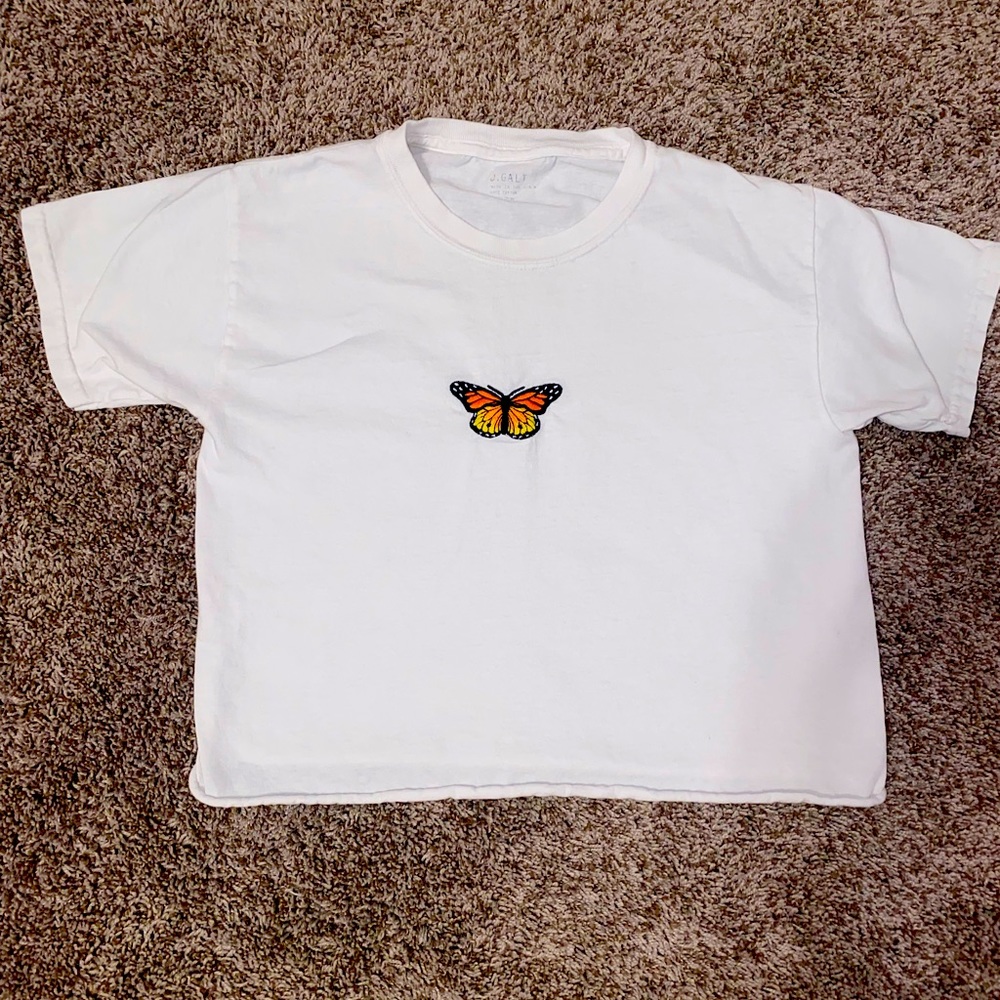 This is a brandy top it’s white with butterfly in the middle!!